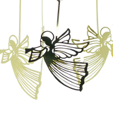 Four gold Scandinavian-style angel ornaments with wings and trumpets hang suspended; one appears darker in front, while three lighter ones are blurred in the background.