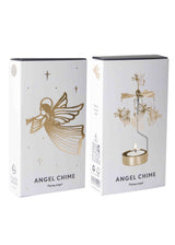 Two white boxes labeled “Angel Chime” with gold flying angels and an illustrated rotary candle holder in a Scandinavian style.