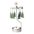 Metal rotary candle holder carousel with Christmas tree-shaped ornaments and a star topper, spinning above a lit tealight candle, on a white background.
