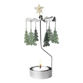Metal rotary candle holder carousel with Christmas tree-shaped ornaments and a star topper, spinning above a lit tealight candle, on a white background.