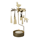 Gold-tone metal Swedish candle carousel featuring hanging Nativity figures, a star topper, and a burning tea light in the base.