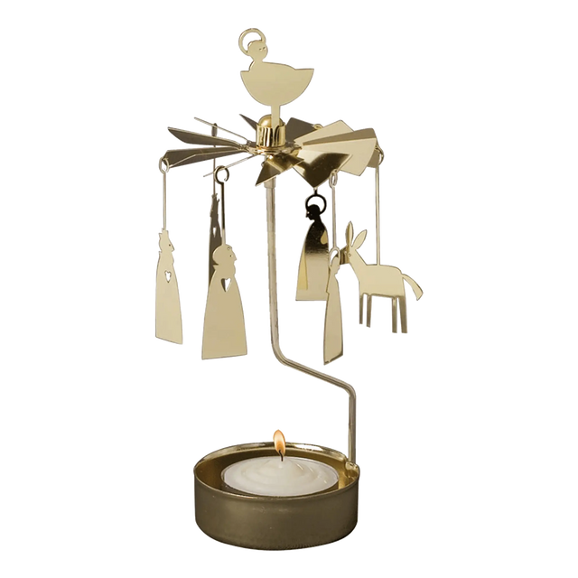 Gold-tone metal Swedish candle carousel featuring hanging Nativity figures, a star topper, and a burning tea light in the base.