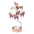 Rose gold Dala Horse metal figures spin on a rotary candle holder above a tealight in a copper holder, shown against a plain white background.