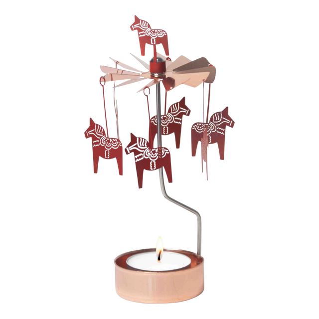 Rose gold Dala Horse metal figures spin on a rotary candle holder above a tealight in a copper holder, shown against a plain white background.