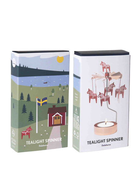 Rotary candle holder in rose gold with Swedish Dala horse charms and countryside motifs. Metal spinner at the top. Candle base is empty; no candle included.