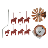 Six red Dala horse ornaments, a bent metal rod, a copper wind spinner, and a coiled copper strip arranged on a white surface.