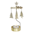 Gold rotary candle holder with star-topped Christmas tree-shaped ornaments spinning above a lit tealight. Plain white background.
