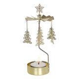 Gold rotary candle holder with star-topped Christmas tree-shaped ornaments spinning above a lit tealight. Plain white background.