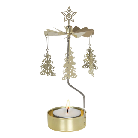 Gold rotary candle holder with star-topped Christmas tree-shaped ornaments spinning above a lit tealight. Plain white background.