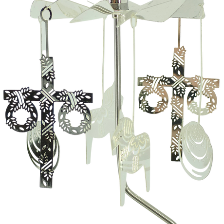 Scandinavian-style rotary candle holder with four hanging metal ornaments, including cross designs with wreath accents, shown against a white background.