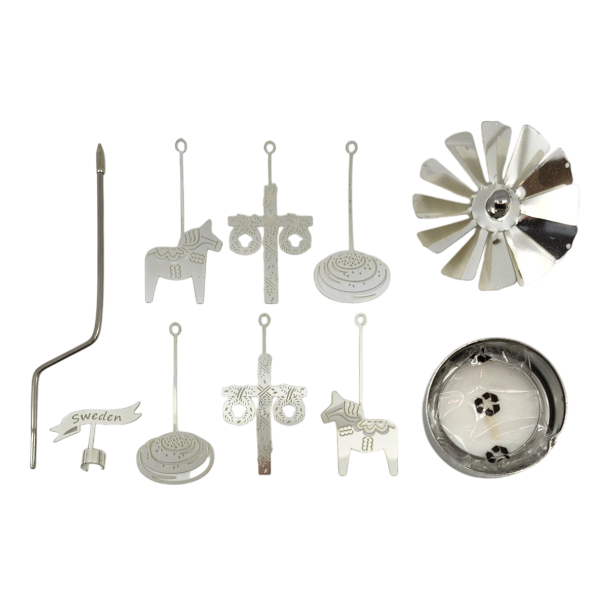 Assorted silver metal parts including a Swedish Dala horse, crosses, circular pieces, a fan blade, and a Sweden sign displayed on a white background.