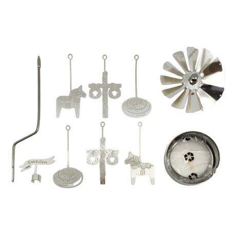 Assorted silver metal parts including a Swedish Dala horse, crosses, circular pieces, a fan blade, and a Sweden sign displayed on a white background.