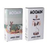 Two boxes showing Moomin-themed Angel Chime sets; one with the Moomin family outdoors, the other with figures spinning around a small candle.