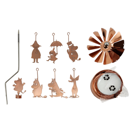 Rose gold Moomin family charms, a metal rod, spinning fan blade, candle holder parts, and two tealight candles arranged on a white background.