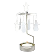 Silver-tone metal rotary candle holder with dangling snowman silhouettes and a lit tea light.