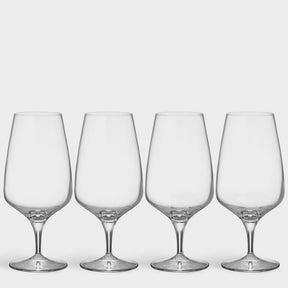 Four clear Orrefors Pulse Beer Glasses (18.5oz, 4-pack), designed by Ingegerd Raman, showcase Scandinavian simplicity as they stand in a row against a plain white background.