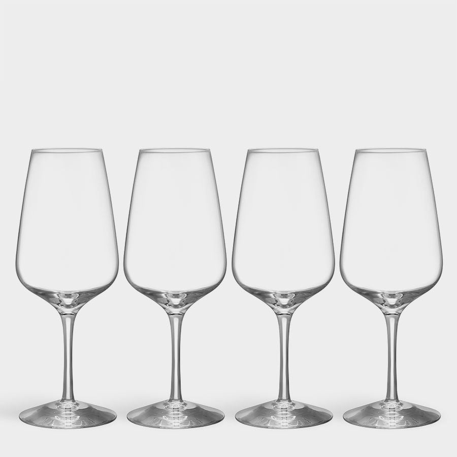 Four empty Orrefors Pulse White Wine Glasses (4-Pack) stand elegantly against a plain white background, showcasing the refined design Orrefors is renowned for—perfect for savoring your favorite white wine with sophistication and style.