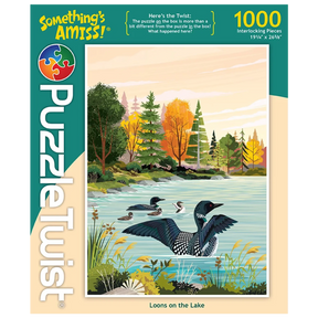 1000-piece puzzle showing Minnesota loons swimming on a lake beneath pale clouds, with trees in fall colors. Artwork by Tim Chapman visible on the box.