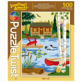 500-piece puzzle showing a lakeside cabin surrounded by trees, with a canoe on the water, woodpecker on a tree, ducks swimming, fish, frog, and turtle visible.