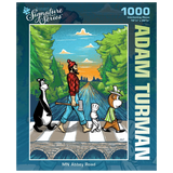 Puzzle box featuring a man and three cartoon animals crossing a road Abbey Road-style, with trees and a sunset in the background. “Adam Turman” visible on the box.