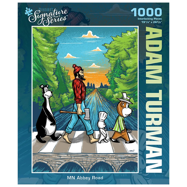 Puzzle box featuring a man and three cartoon animals crossing a road Abbey Road-style, with trees and a sunset in the background. “Adam Turman” visible on the box.