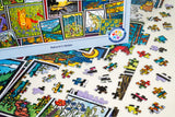 Vibrant jigsaw puzzle pieces are spread across a table, with several connected to form part of the picture. The Maynards box features Sarah Angst’s nature-themed artwork of animals, flowers, and landscapes. The title “Puzzle: Nature’s Notes 1000 Piece ‘Mixed Up!’ PuzzleTwist Jigsaw Puzzle” is clearly shown—a delightful activity for a peaceful afternoon.