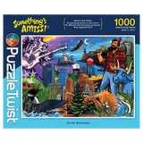 Puzzle box with colorful illustration of Paul Bunyan, Babe the Blue Ox, city skyline, wildlife, river, and text “Somethings Amiss! 1000 piece puzzle.”.