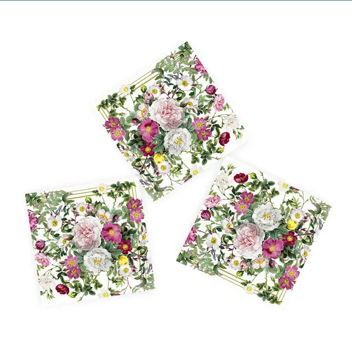 Three dinner napkins with floral designs, featuring pink, white, and yellow flowers and green leaves on a white background. These Rose Flower Garden napkins are crafted from recycled FSC paper.