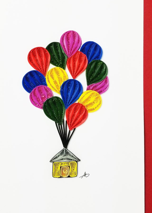 The Cards: House with Balloons Quilling Card 5x7 features intricate paper quilling art of a house with balloons on a pristine white background, making it the perfect gift for a memorable housewarming celebration.