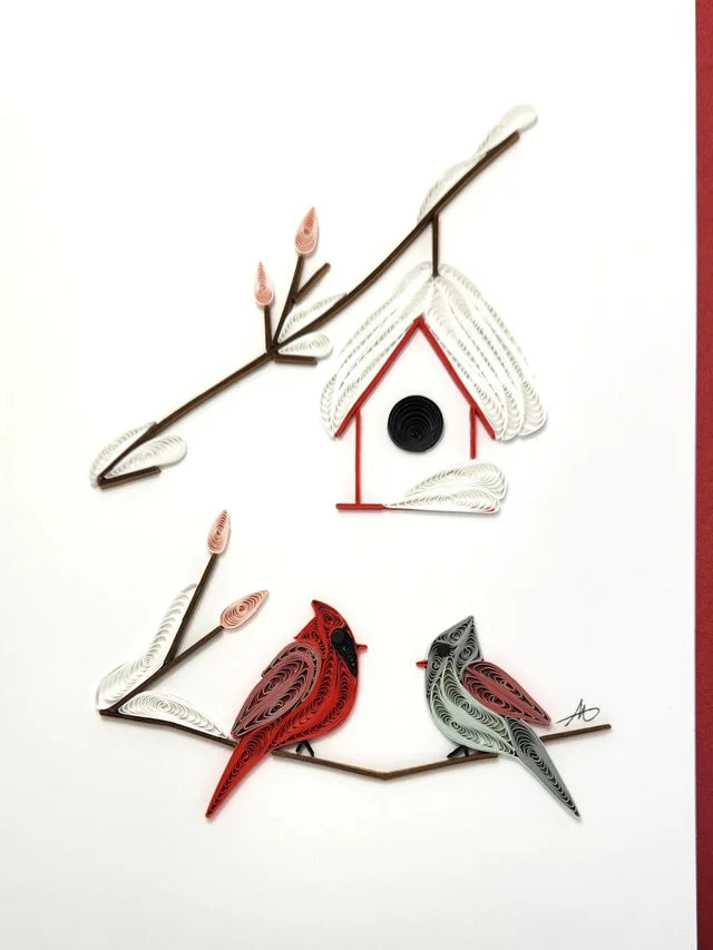 The Cards: Winter Cardinal Couple Quilling Card 5x7 features a birdhouse on a branch above two birds, handcrafted with colored paper quilling on a white background—perfect for holiday greetings.