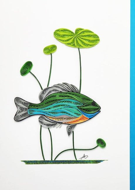 The Cards: Bluegill Fish Quilling Card 5x7 features hand-crafted quilled art of a Bluegill Fish and three lily pads on white with a blue border, perfect for celebrating Minnesota’s lakes.