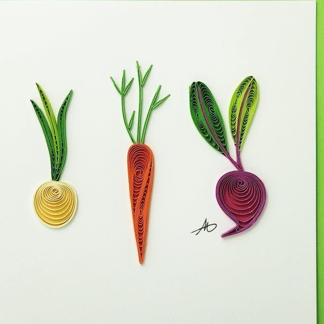 The "Cards: Vegetables Quilling" card beautifully showcases the intricate art of a yellow onion, orange carrot, and purple beet against a light background—making it an ideal gift for any passionate gardener.