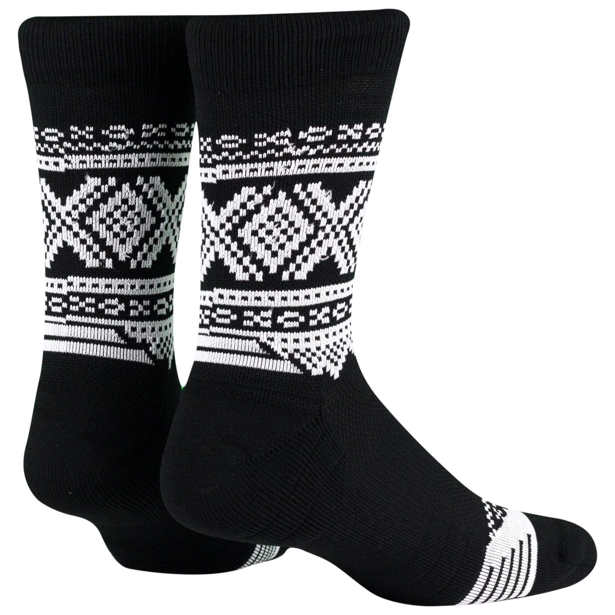 Marius Aktiv Black Crew Socks feature white geometric patterns, including diamonds and stripes, displayed upright with toes pointing left.