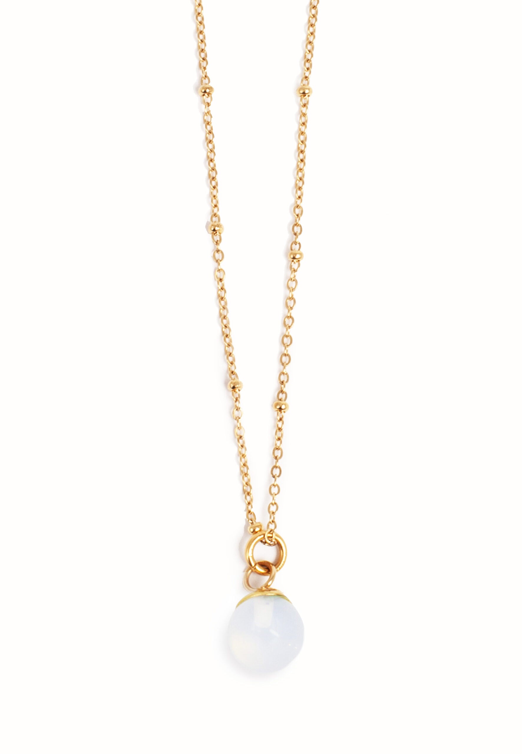 The Semi Precious Moon Stone Necklace features a captivating round pendant on a 14k gold-plated steel chain, merging elegance with the enchanting allure of moonstone.