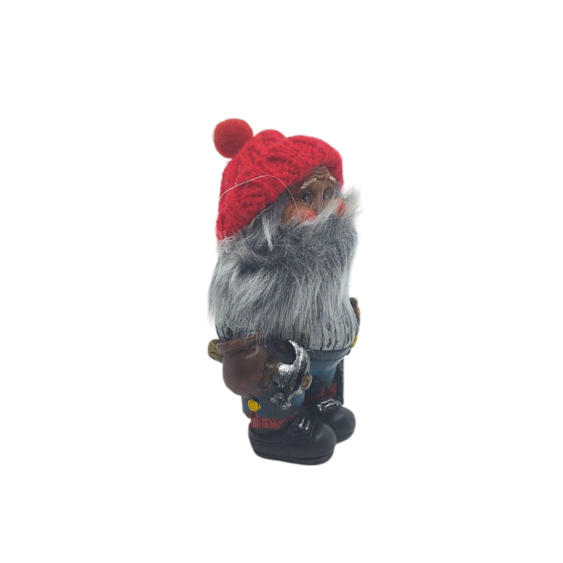 A side-view of the Scandinavian figurine named Nisse Man with a Knit Hat and Hammer, depicting a bearded gnome wearing a red knit hat and holding a small axe.