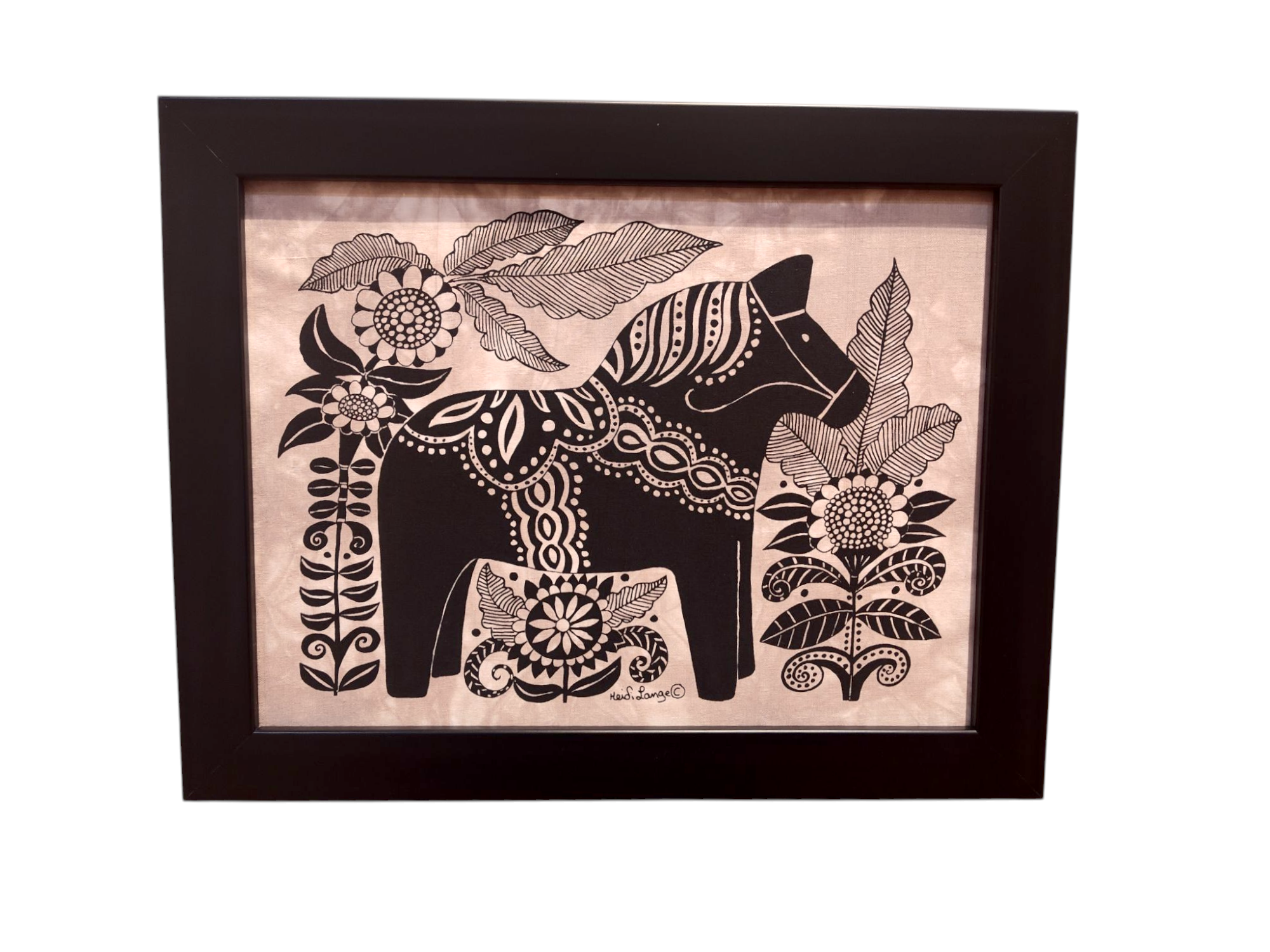 This black-framed artwork features a stylized Dala Horse adorned with decorative patterns, elegantly surrounded by large flowers and leaves; titled Dala Horse with Flowers Framed Batik Artwork, it measures 11x14.