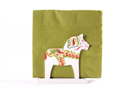 A green napkin stands upright, supported by a Napkin Holder: White Dala Horse Napkin Stand.