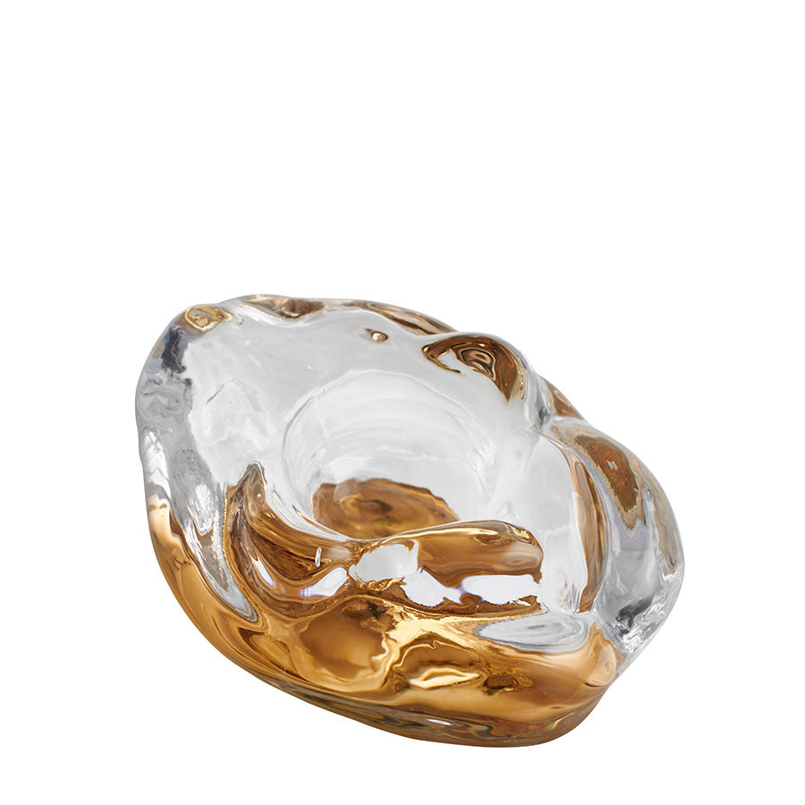 The KostaBoda: Snippan Clear Gold AC-24 bowl showcases a fluid, wavy design in clear and amber, echoing the elegant curves of Kosta Bodas iconic Snippan sculpture.