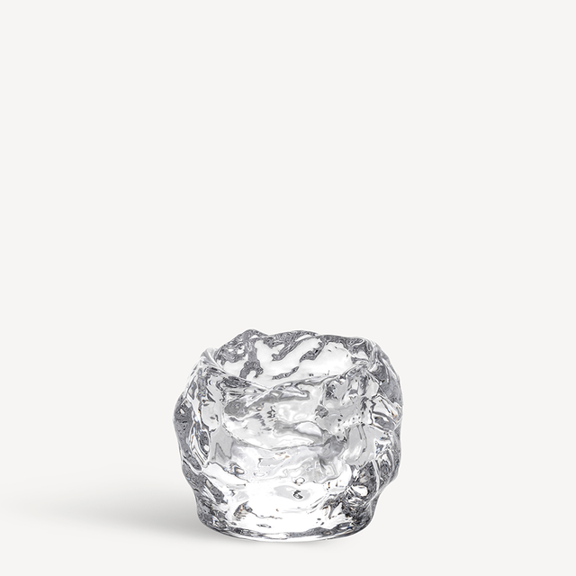 The KostaBoda: Snowball Votive Small 60mm by Ann Warff is a clear glass candle holder with an irregular, melting ice-like texture, reminiscent of the iconic design and shown against a plain white background.