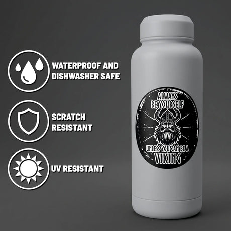 White bottle with a Viking graphic and the text “Always be yourself unless you can be a Viking.” Nordic design stickers are also visible on the surface.