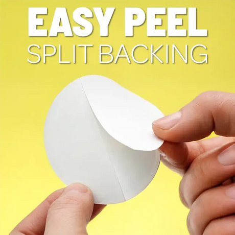 A hand peels the split backing off a round Swedish Gift Store Viking DNA Sticker with Period Accurate Helmet (3.45″ x 4″) against a yellow background. Text reads, EASY PEEL SPLIT BACKING.