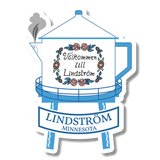 Blue and white sticker showing a water tower with floral accents, a ribbon reading Lindström Minnesota, and a steaming Swedish coffee pot spout on the left side.