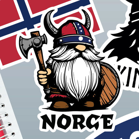 Sticker featuring a cartoon Viking holding an axe and shield, wearing a horned helmet, standing in front of the Norwegian flag with the word “NORGE” below.