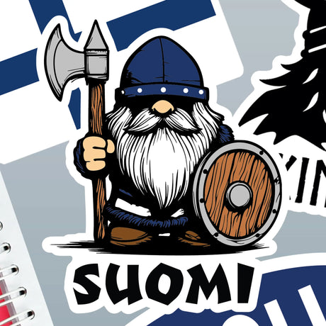 Cartoon Viking holding an axe and shield, wearing a helmet, standing above the word “Suomi” on a Finnish flag background. Product is a sticker.