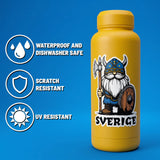 Yellow bottle with a blue sticker showing a Swedish Viking cartoon labeled “Sverige,” featuring a gnome in traditional Nordic attire.