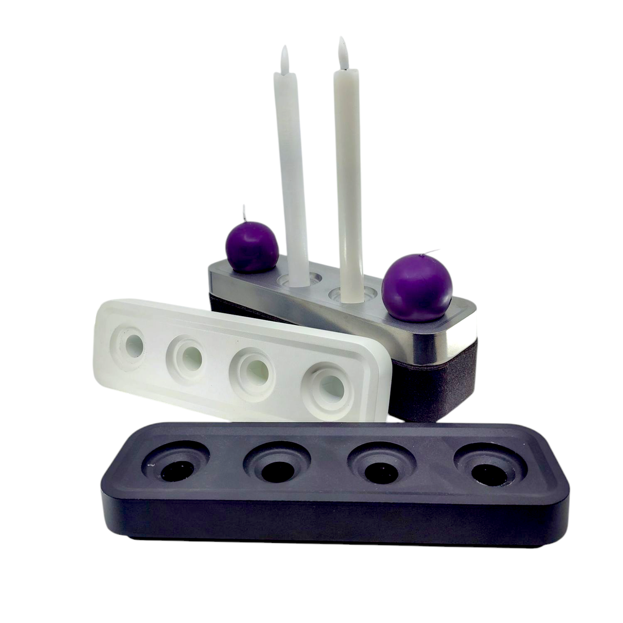 The Stumpastaken Swedish Candle Holder holds 4 candles and is available in black, white, and dark gray. Eco-friendly, it’s perfect for displaying tapers or spheres—two holders here feature white taper and purple sphere candles.