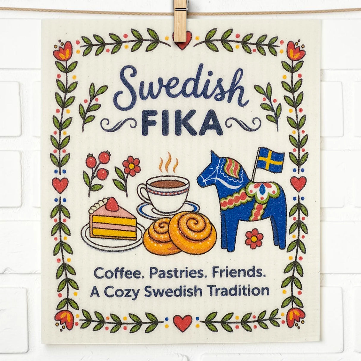 Eco-friendly kitchen cloth with Swedish Fika design, featuring coffee, pastries, a Dala horse holding a Swedish flag, and the text: Coffee. Pastries. Friends.