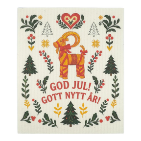 Scandinavian dishcloth with a red goat, green trees, red hearts, and floral motifs; text reads “God Jul! Gott Nytt År!”.