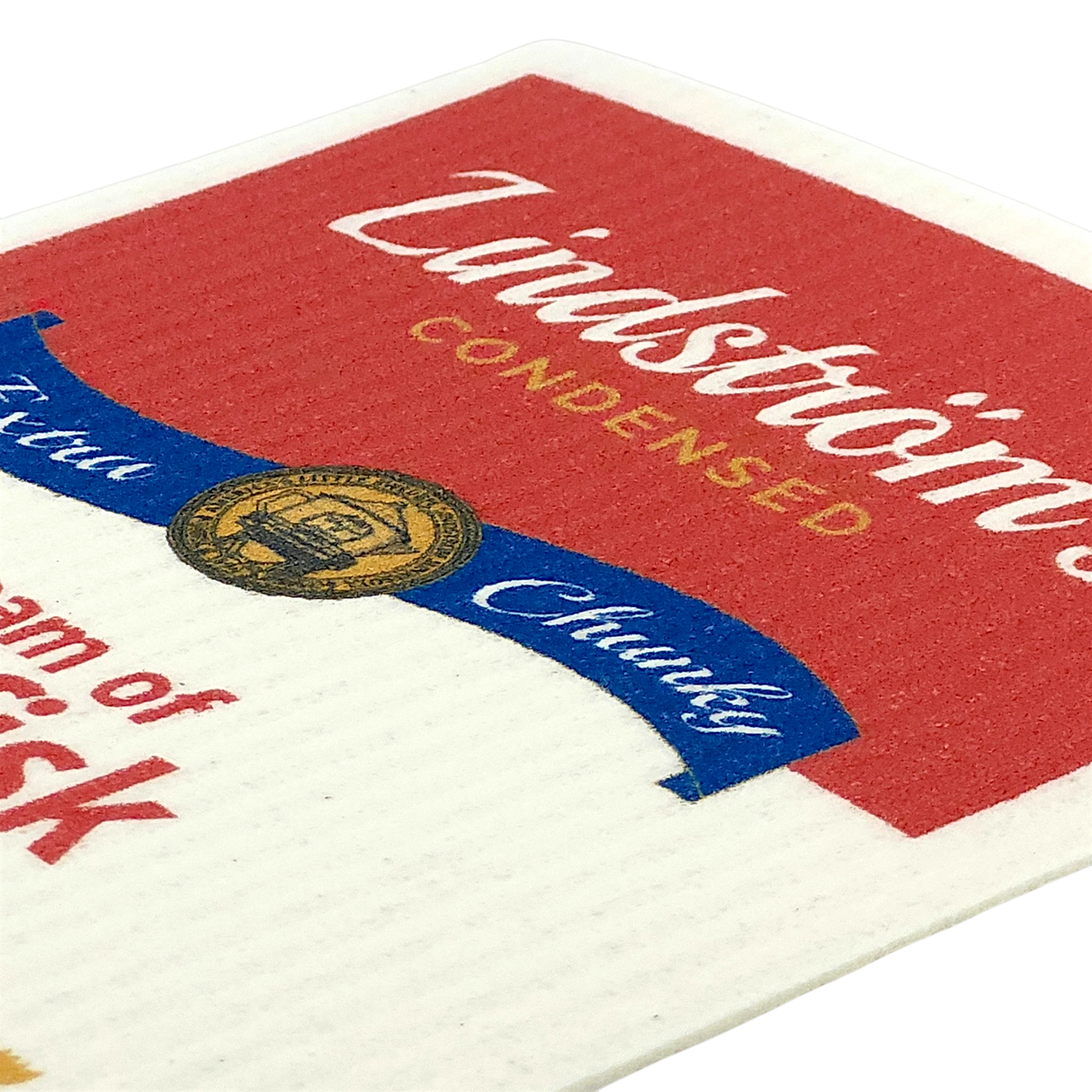 Close-up of a lutefisk soup can label with “Lindströms Condensed” in white and yellow text on red and white background, featuring a gold and blue emblem.