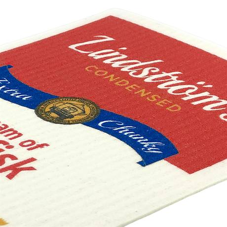 Close-up of a lutefisk soup can label with “Lindströms Condensed” in white and yellow text on red and white background, featuring a gold and blue emblem.